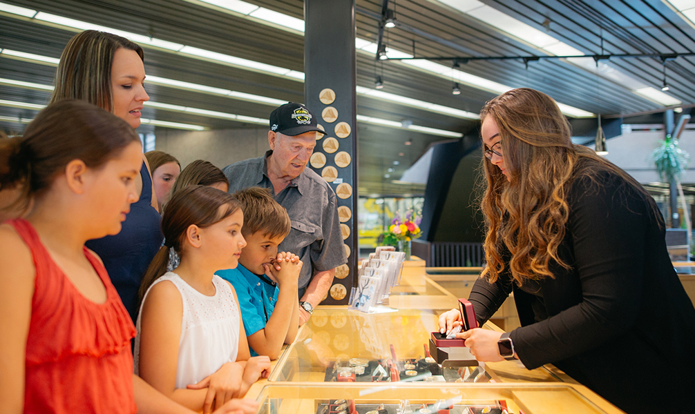 Photo of people shopping at the Winnipeg Mint Boutique.