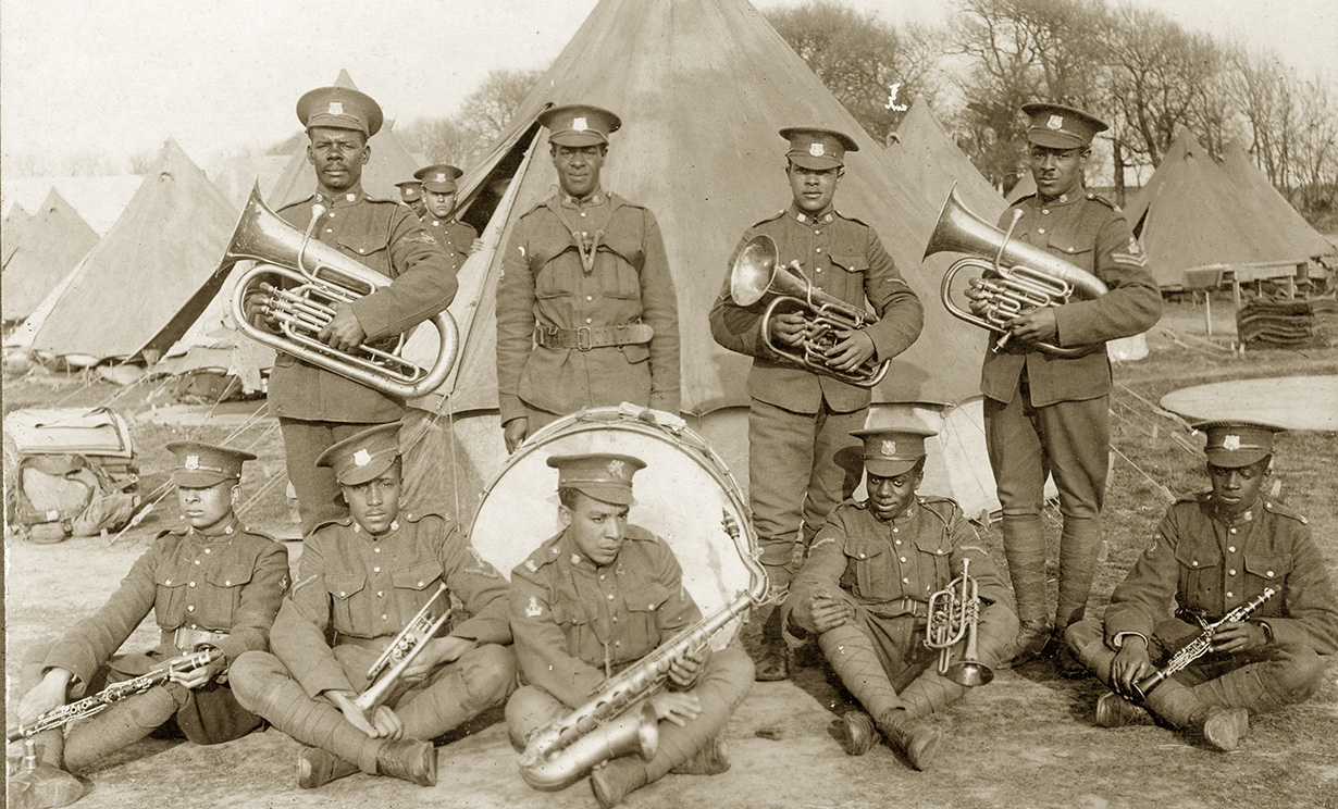 Nine members of the No. 2 Construction Battalion band with instruments